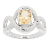 Cushion cut yellow gemstone ring set in polished sterling silver with elegant wave design.